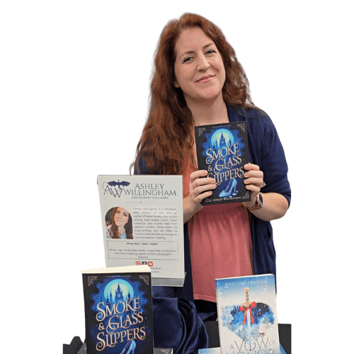 Join my Community A picture of Ashley Willingham holding up one of her books